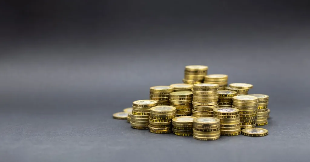 Gold coins stacked neatly representing the accumulation of tangible wealth